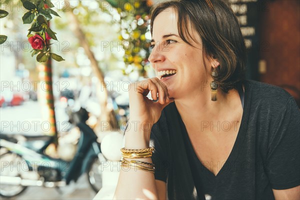 Caucasian woman laughing outdoors