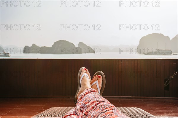 Caucasian woman on boat in Ha Long Bay