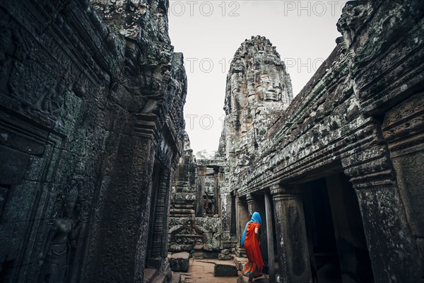 Woman exploring ruins at Angkor Wat