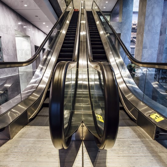 Close up of escalator handrail in office building