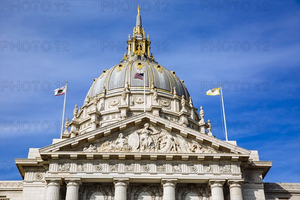 Low angle view of ornate building under blue sky