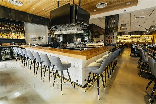 Tables and chairs in modern bar and restaurant