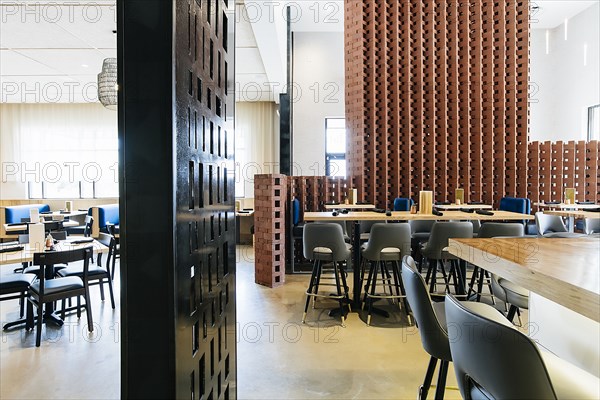 Tables and chairs in modern bar and restaurant