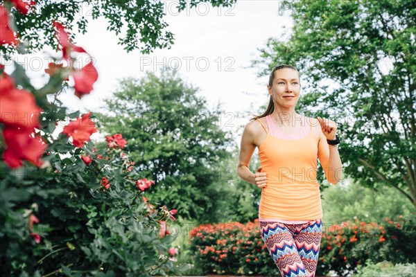 Smiling Caucasian woman running