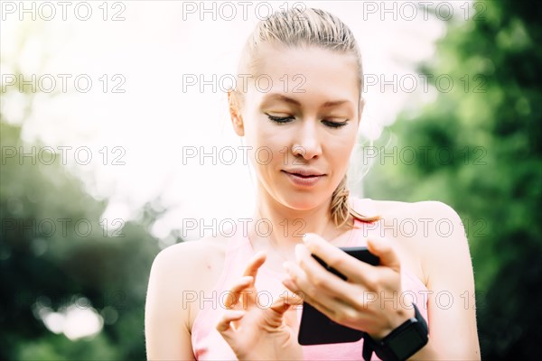 Caucasian woman using cell phone outdoors