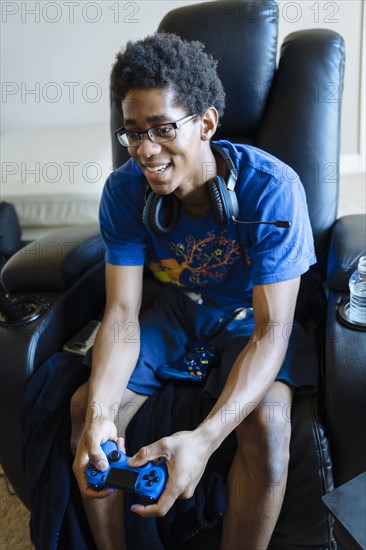 Black man playing video game