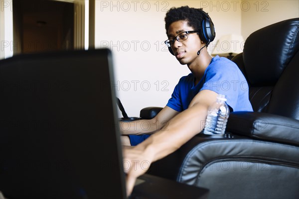 Black man playing video game