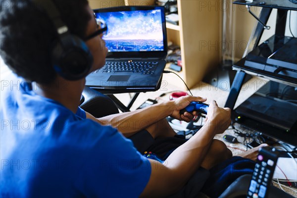 Black man playing video game