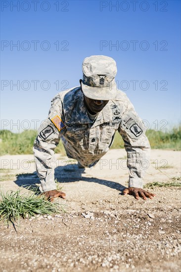 Black soldier doing push-ups