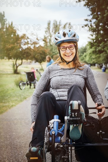 Caucasian woman riding tandem bicycle