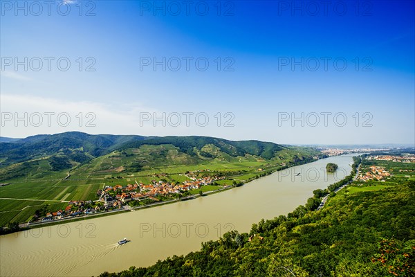 Boats on river near village