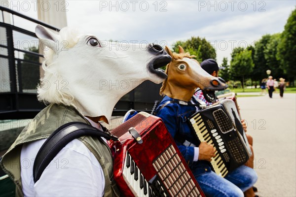 Accordionists wearing horse masks