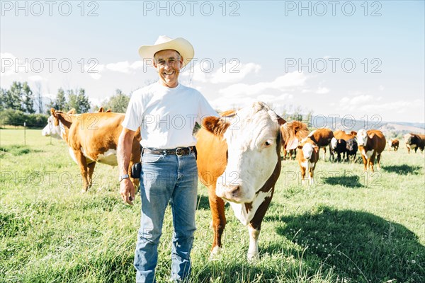 Caucasian farmer petting cow