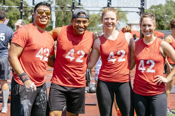 Portrait of friends wearing shirts with number 42