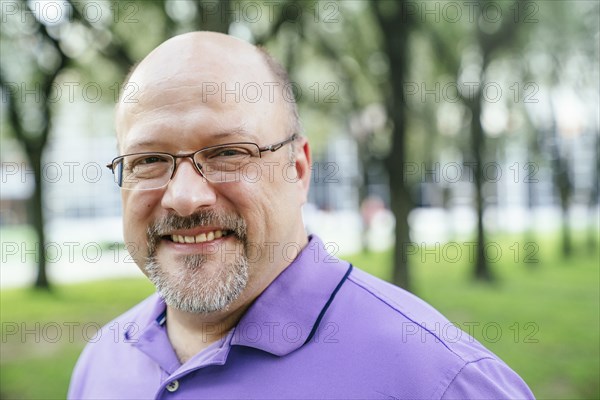 Portrait of smiling Caucasian man in park