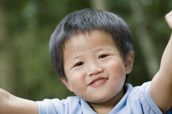 Close up of Asian boy smiling