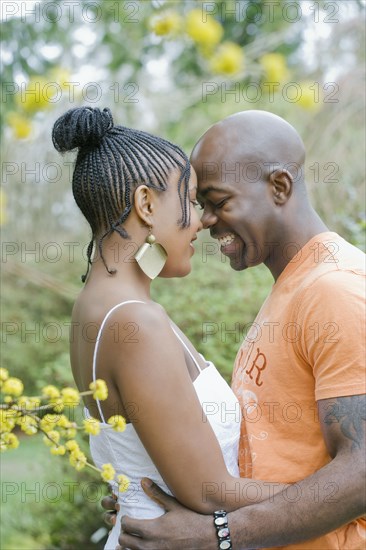 Couple hugging outdoors