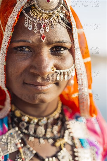 Close up of Indian woman wearing traditional jewelry