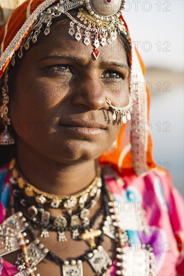 Close up of Indian woman wearing traditional jewelry