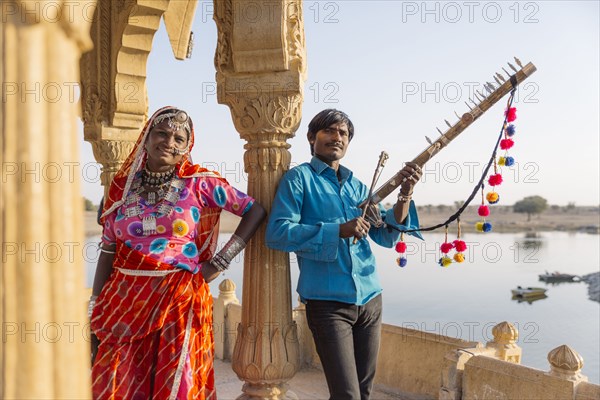 Traditional Indian couple standing in monument