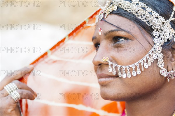 Close up of Indian woman wearing traditional jewelry