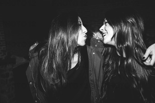 Smiling women laughing at party