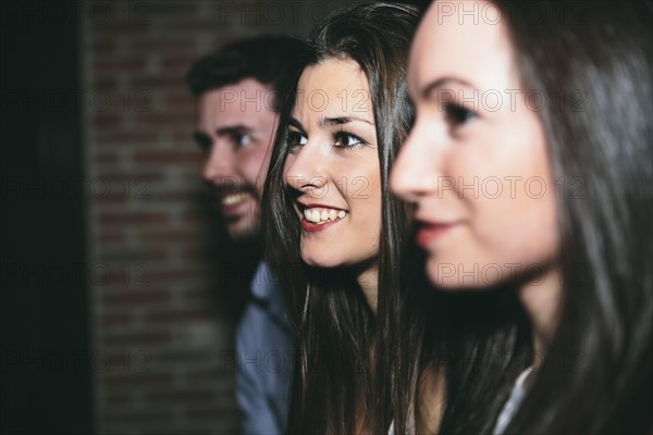 Friends smiling in nightclub