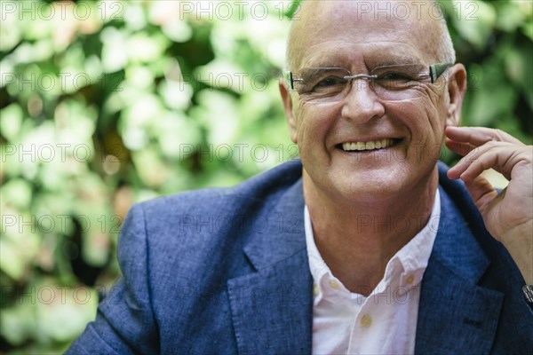 Hispanic businessman smiling outdoors