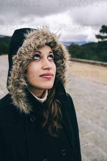 Caucasian woman looking upward