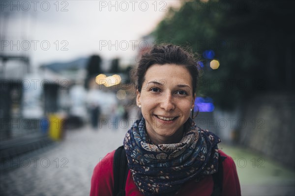 Portrait of smiling Caucasian woman wearing scarf