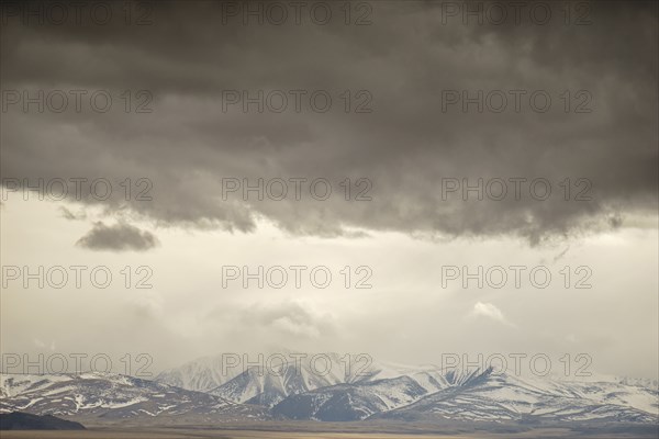 Storm clouds over mountain landscape