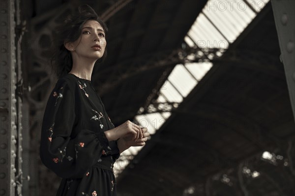 Caucasian woman waiting at train station