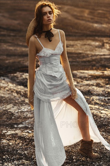 Sexy Caucasian woman wearing white dress