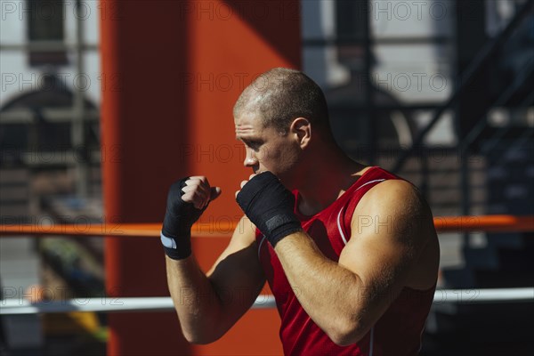 Portrait of Caucasian boxer with fists raised