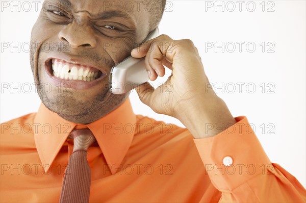 Portrait of businessman talking on cell phone
