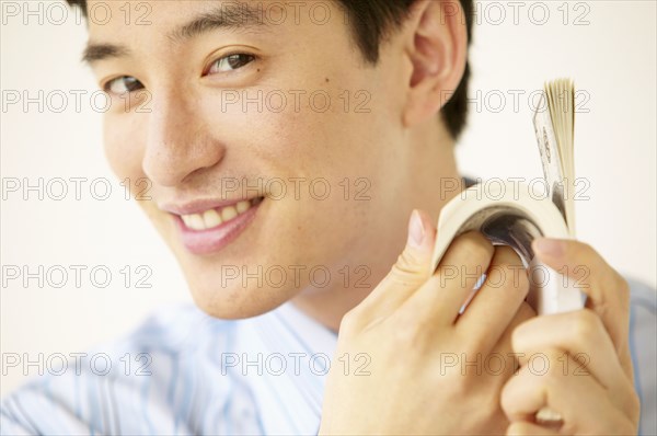 Portrait of businessman holding money