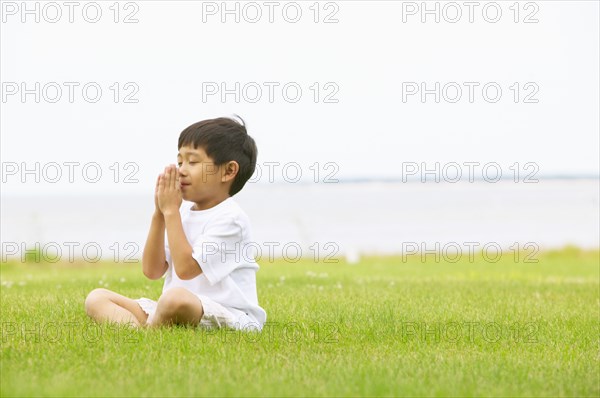 Young boy praying