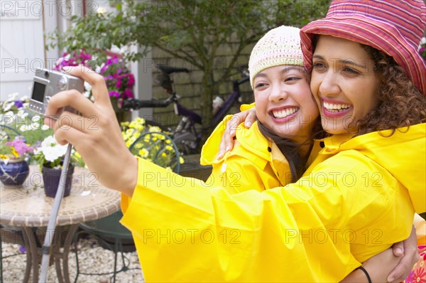 Mother and daughter taking picture