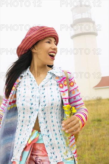 Woman by lighthouse