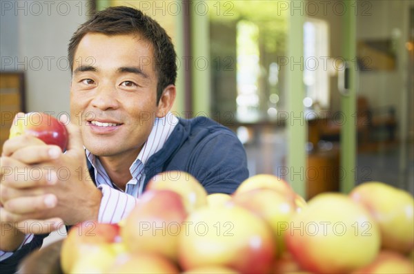 Portrait of man holding apple