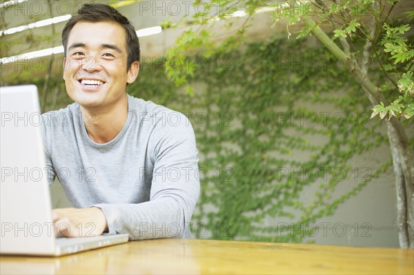 Portrait of man with laptop