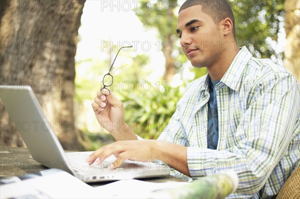 Man typing on laptop