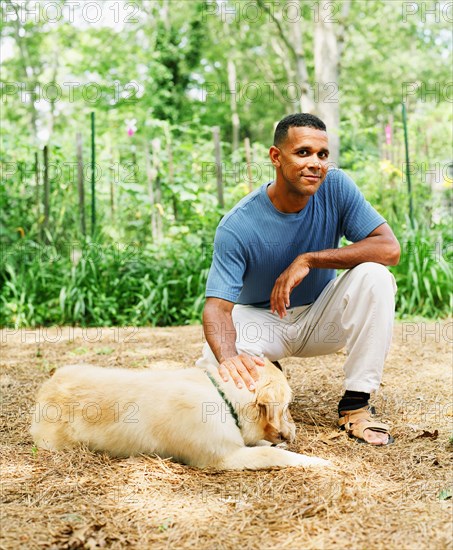 Man petting dog