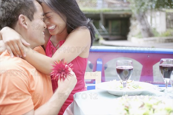 Young couple embracing on a boat