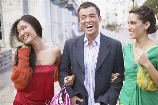 Man escorting two young women