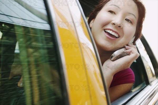 Woman looking through car window