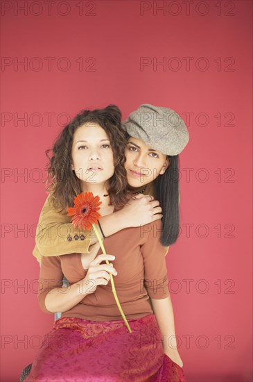 Two women hugging each other