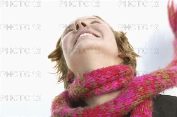 Low angle view of a young woman smiling