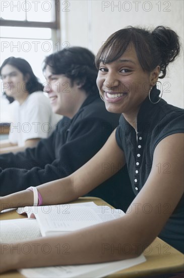 Three high school students in classroom