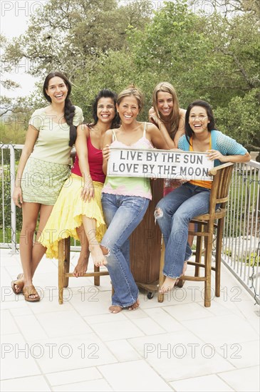 Small group of women holding sign